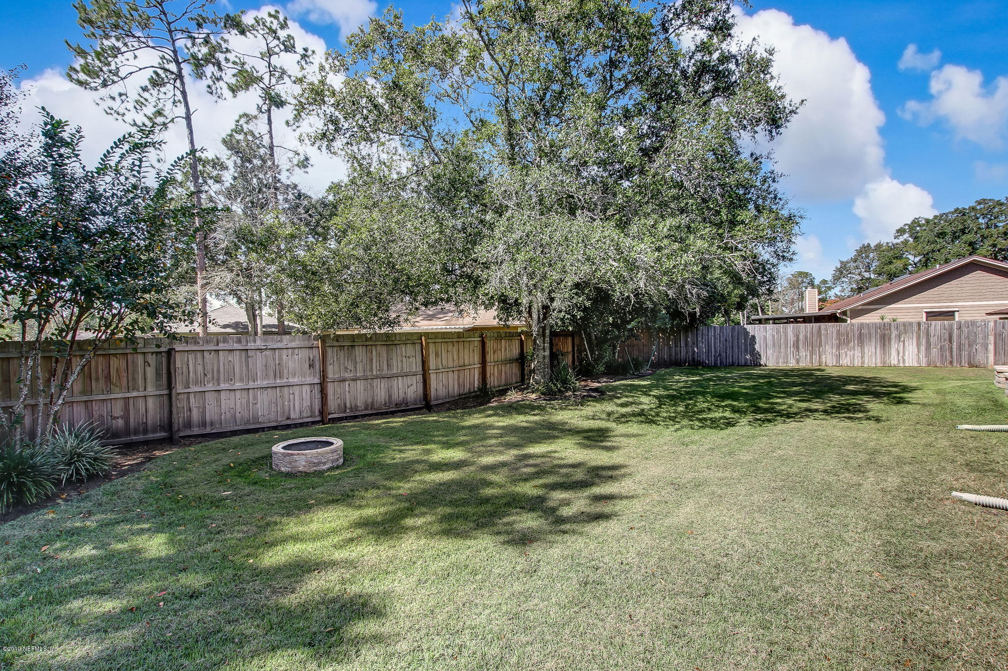 11060 Reading Road Jacksonville, FL 32257 - Photo 39 of 43 a backyard of a house with lots of green space