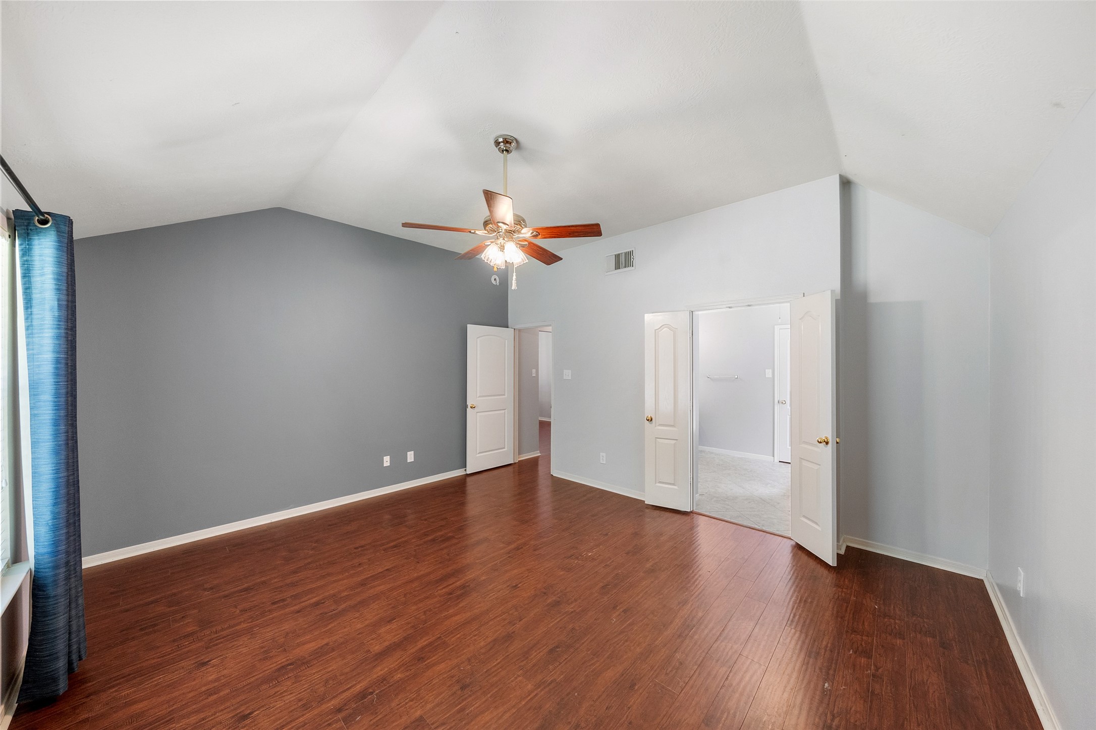 19718 Teller Boulevard Spring, TX 77388 - Photo 20 of 47 an empty room with wooden floor and windows