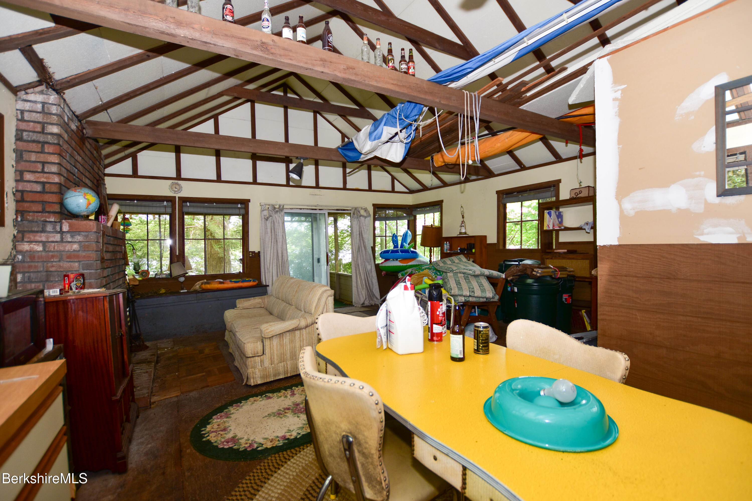 18 Osceola Road Becket, MA 01223 - Photo 7 of 19 a view of a dining room with furniture a chandelier and wooden floor