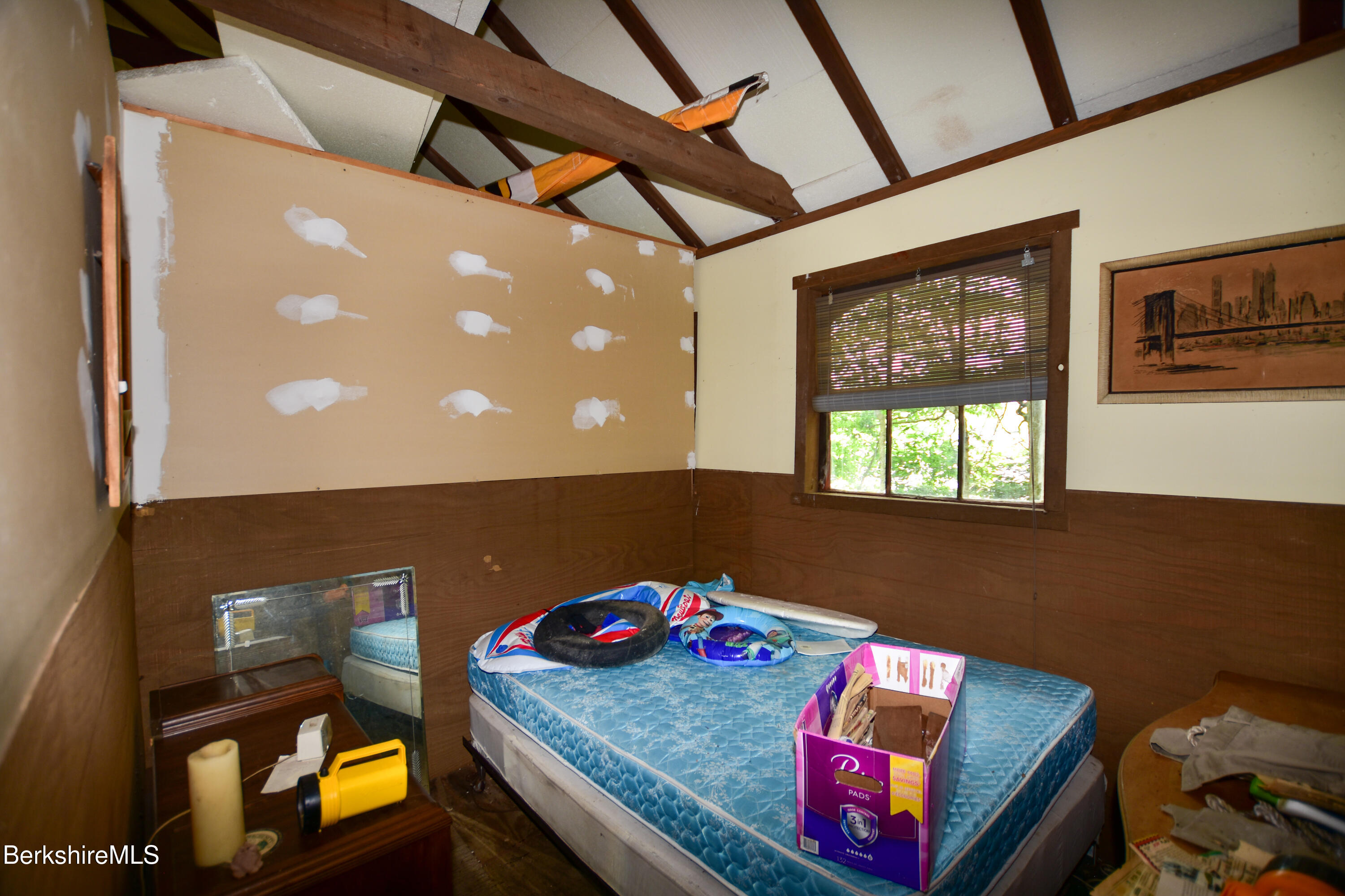 18 Osceola Road Becket, MA 01223 - Photo 10 of 19 a bedroom with a bed and a window