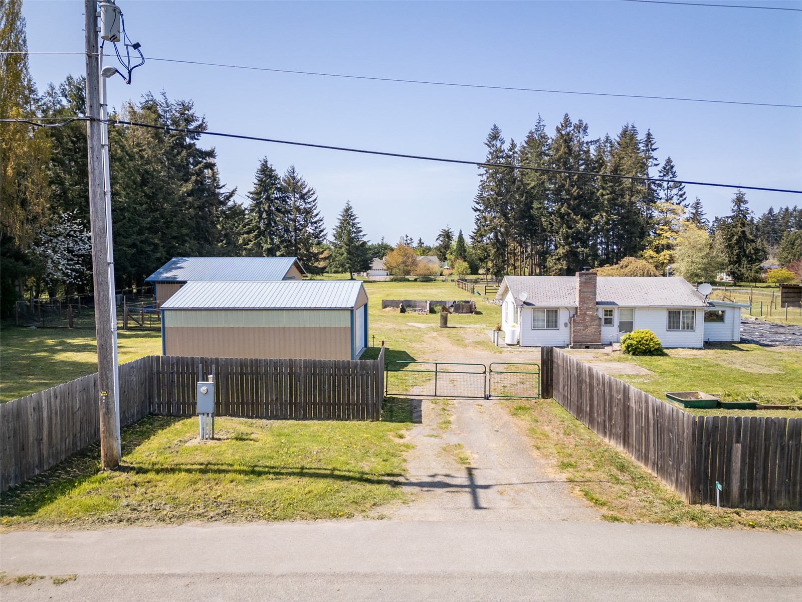 903 North Barr Road Port Angeles, WA 98362 - Photo 34 of 40 a view of a house with a swimming pool and sitting area