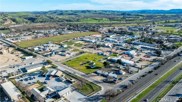 an aerial view of residential houses and outdoor space