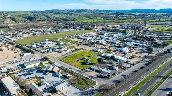 an aerial view of residential houses and outdoor space