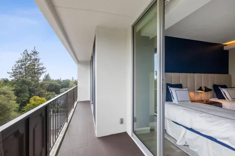 a view of balcony with furniture