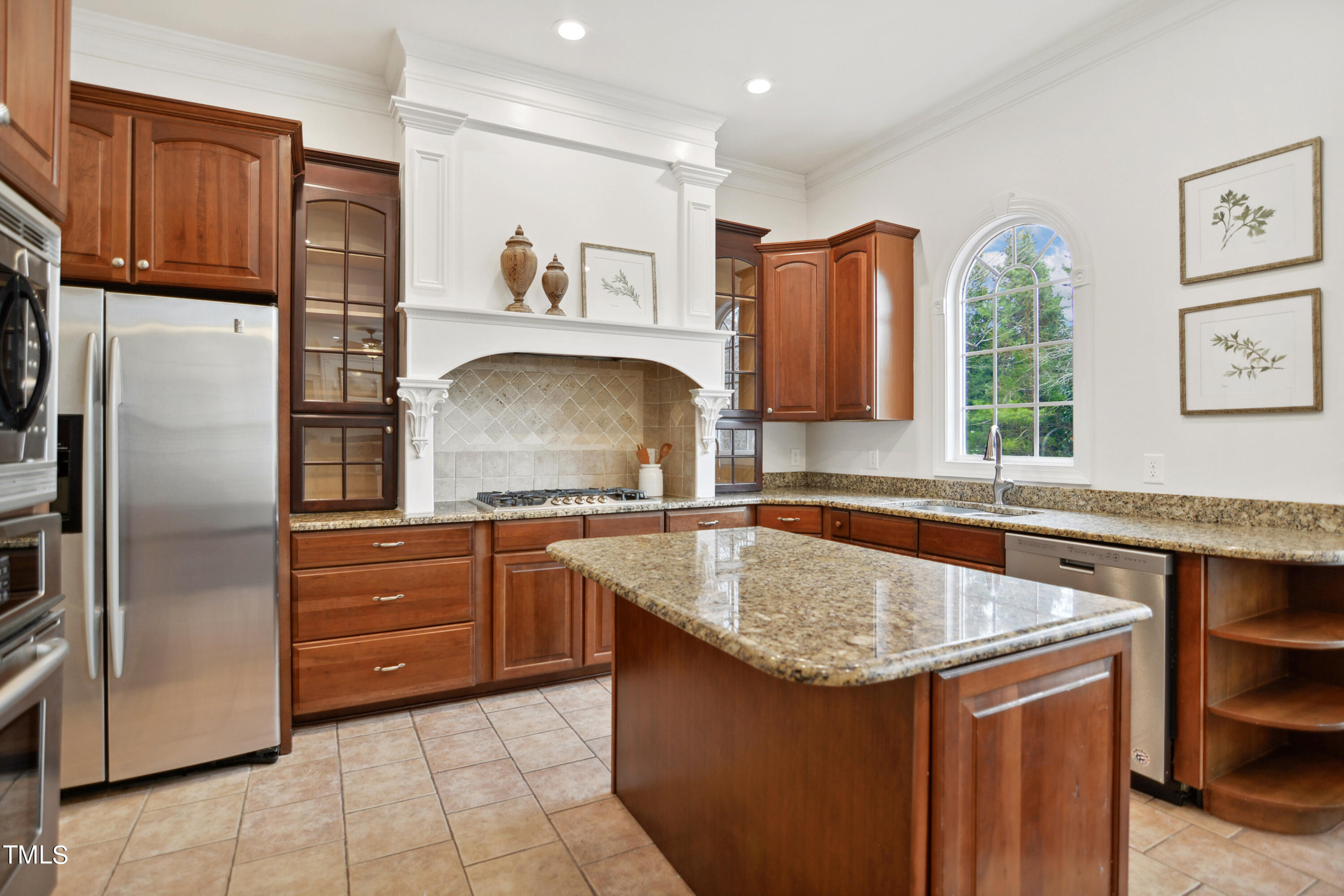 3101 Shinleaf Court Raleigh, NC 27613 - Photo 14 of 44 a kitchen with granite countertop a sink stainless steel appliances and cabinets