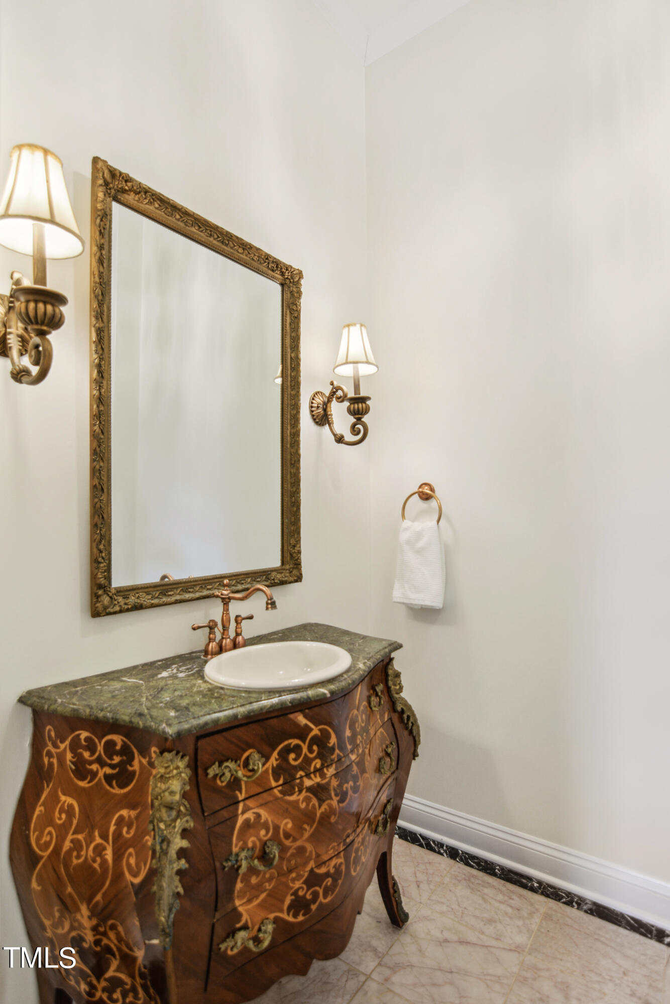 3101 Shinleaf Court Raleigh, NC 27613 - Photo 16 of 44 a bathroom with a sink and mirror