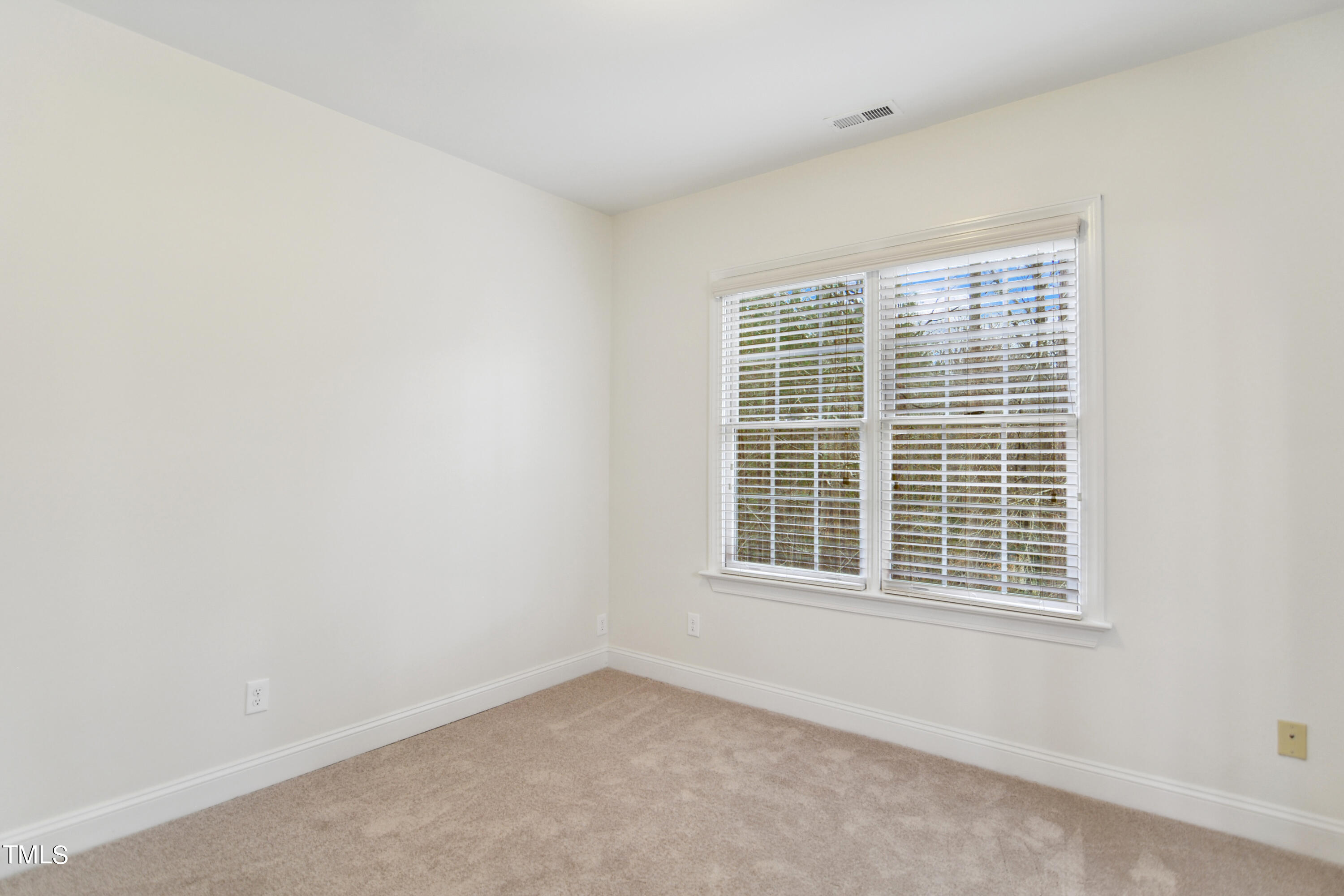 3101 Shinleaf Court Raleigh, NC 27613 - Photo 26 of 44 a view of an empty room with a window