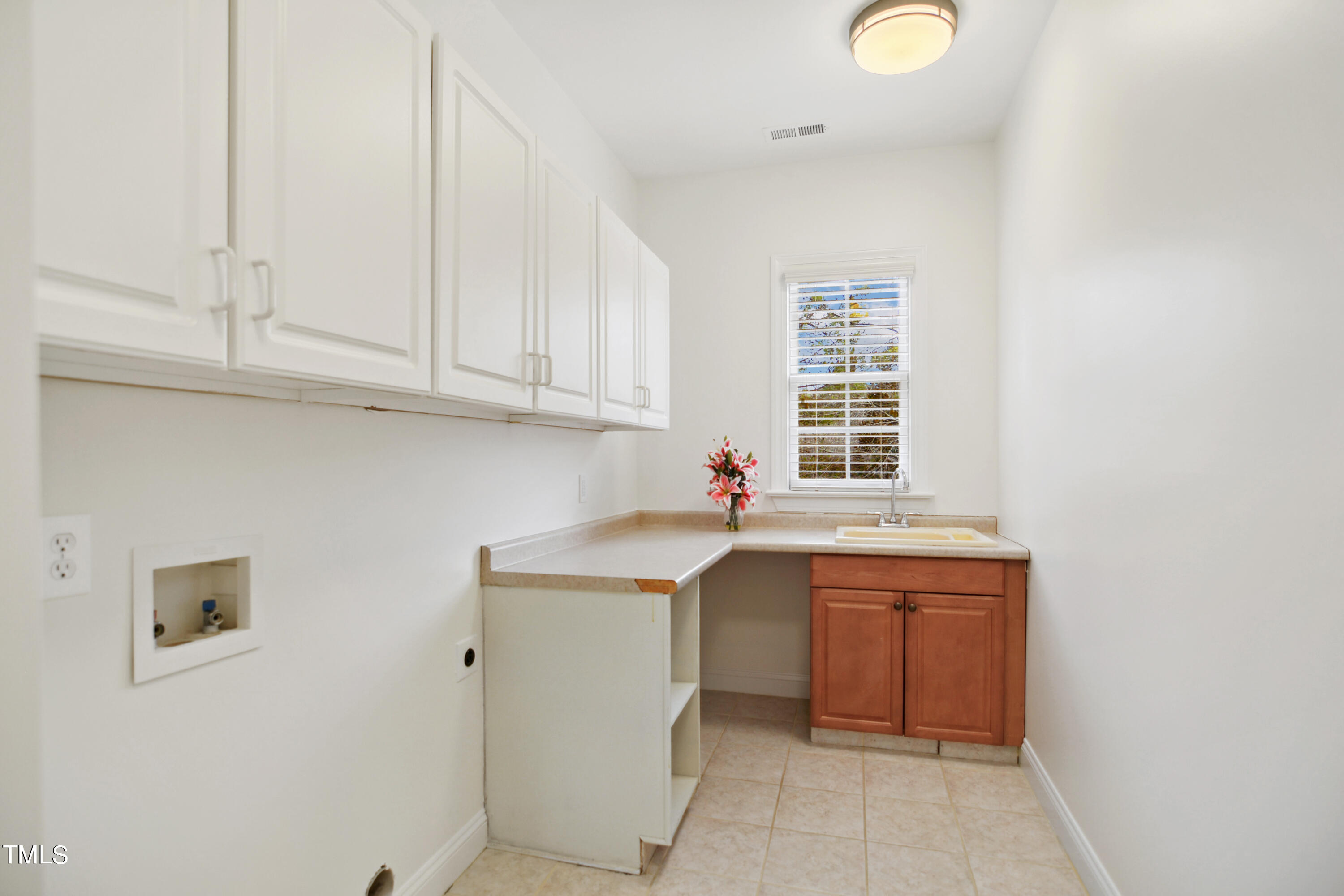 3101 Shinleaf Court Raleigh, NC 27613 - Photo 34 of 44 a kitchen with a sink and cabinets
