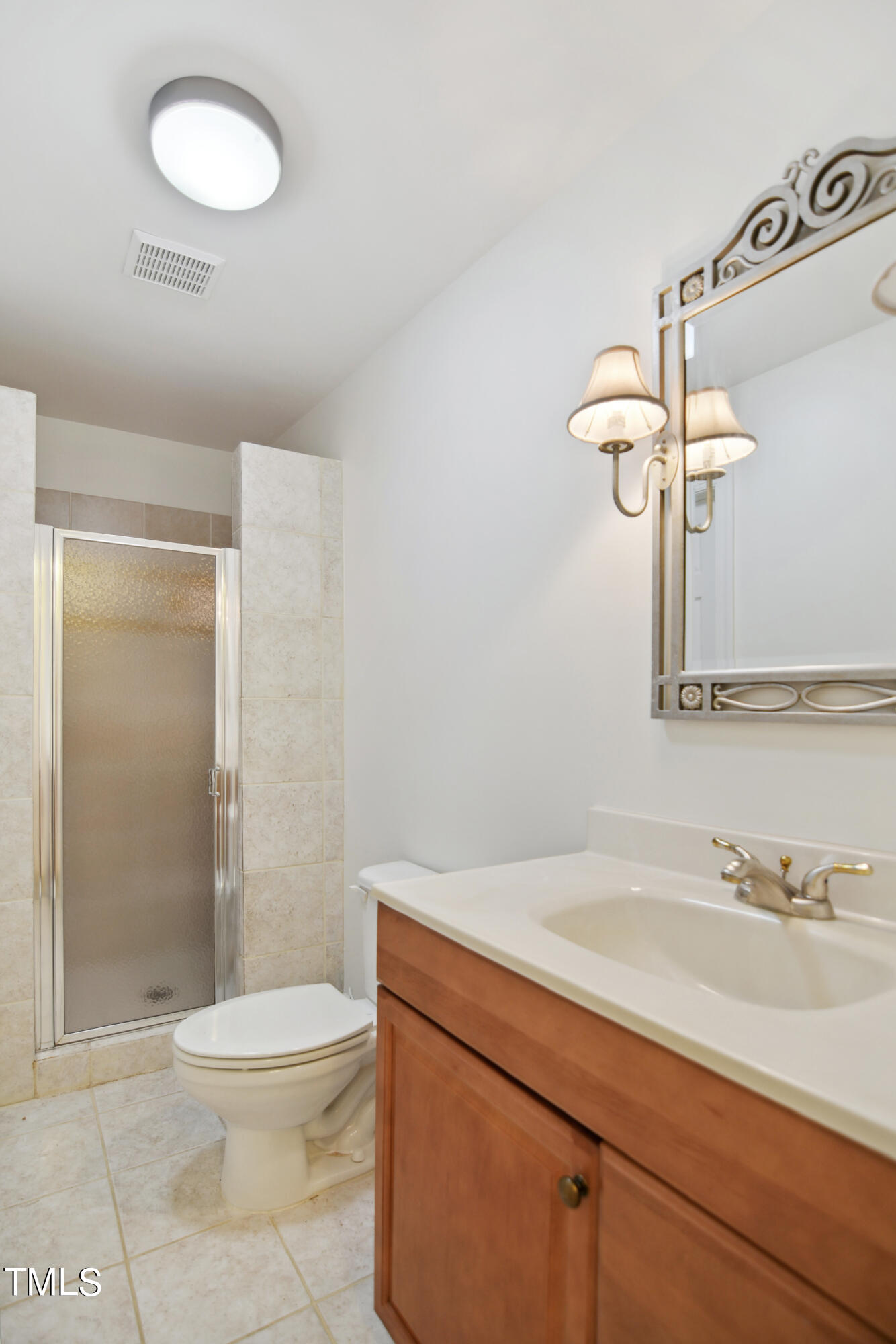3101 Shinleaf Court Raleigh, NC 27613 - Photo 38 of 44 a bathroom with a sink a toilet and shower
