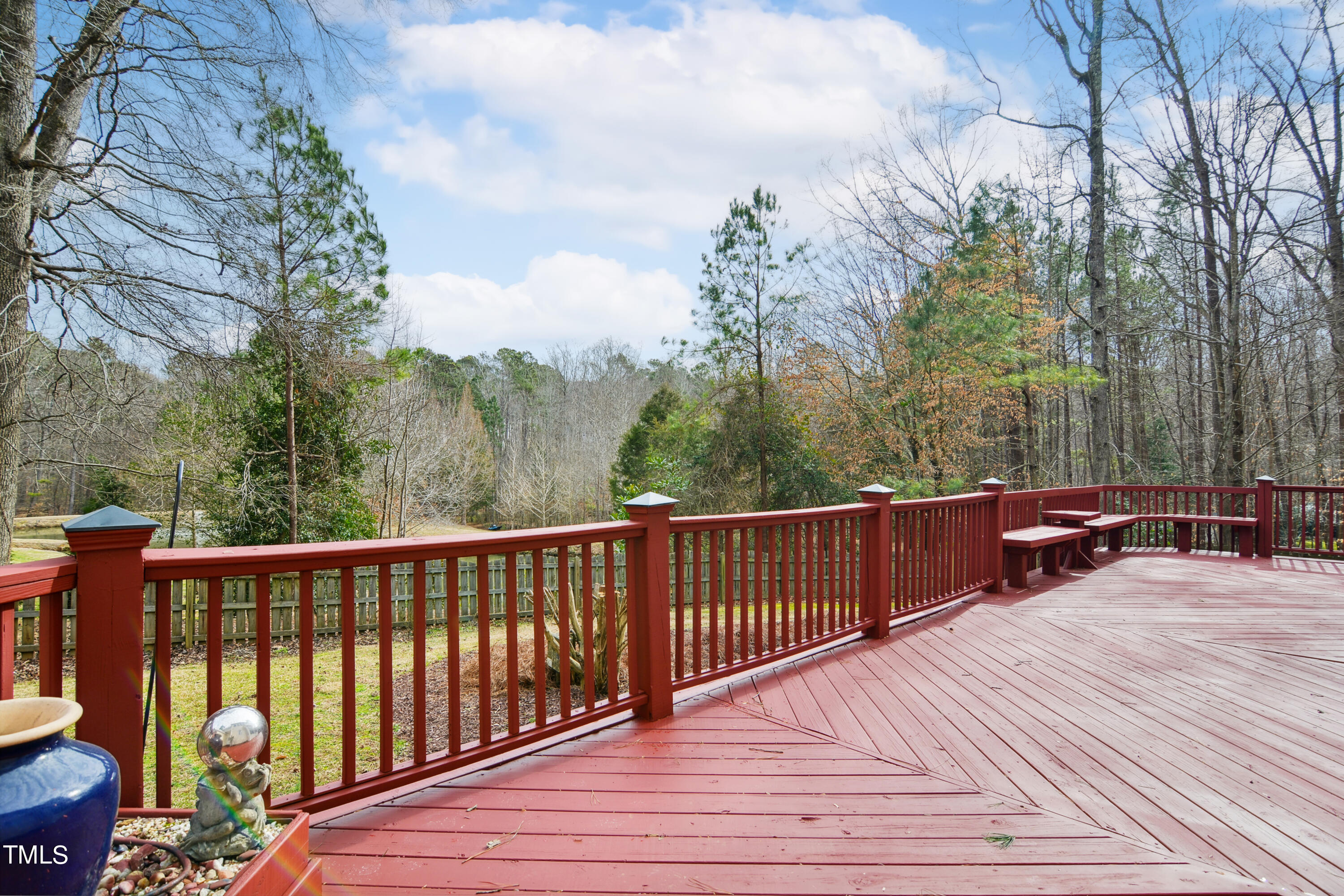 3101 Shinleaf Court Raleigh, NC 27613 - Photo 40 of 44 a balcony with wooden floor and fence