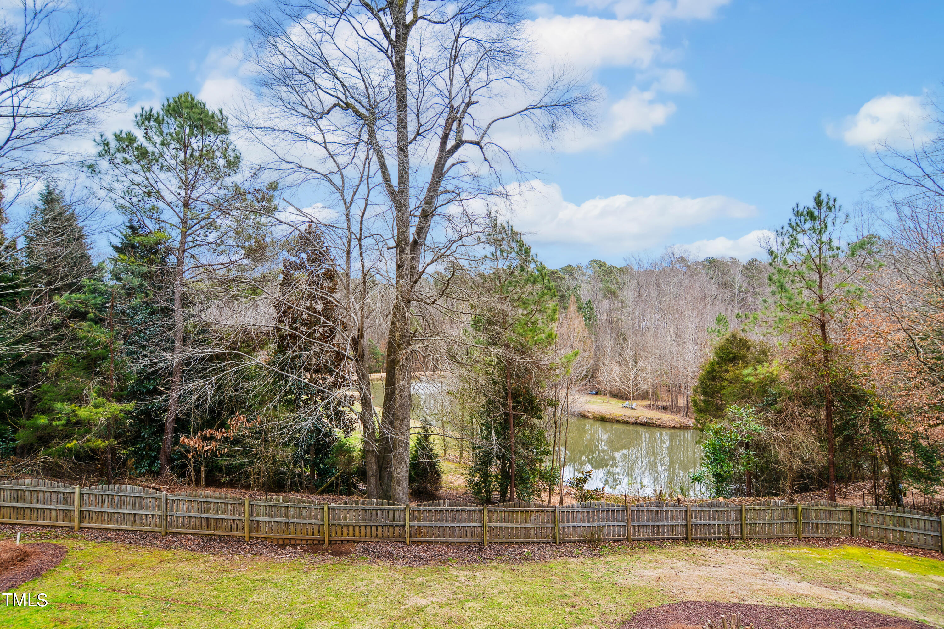 3101 Shinleaf Court Raleigh, NC 27613 - Photo 43 of 44 a view of swimming pool with outdoor seating and trees in the background