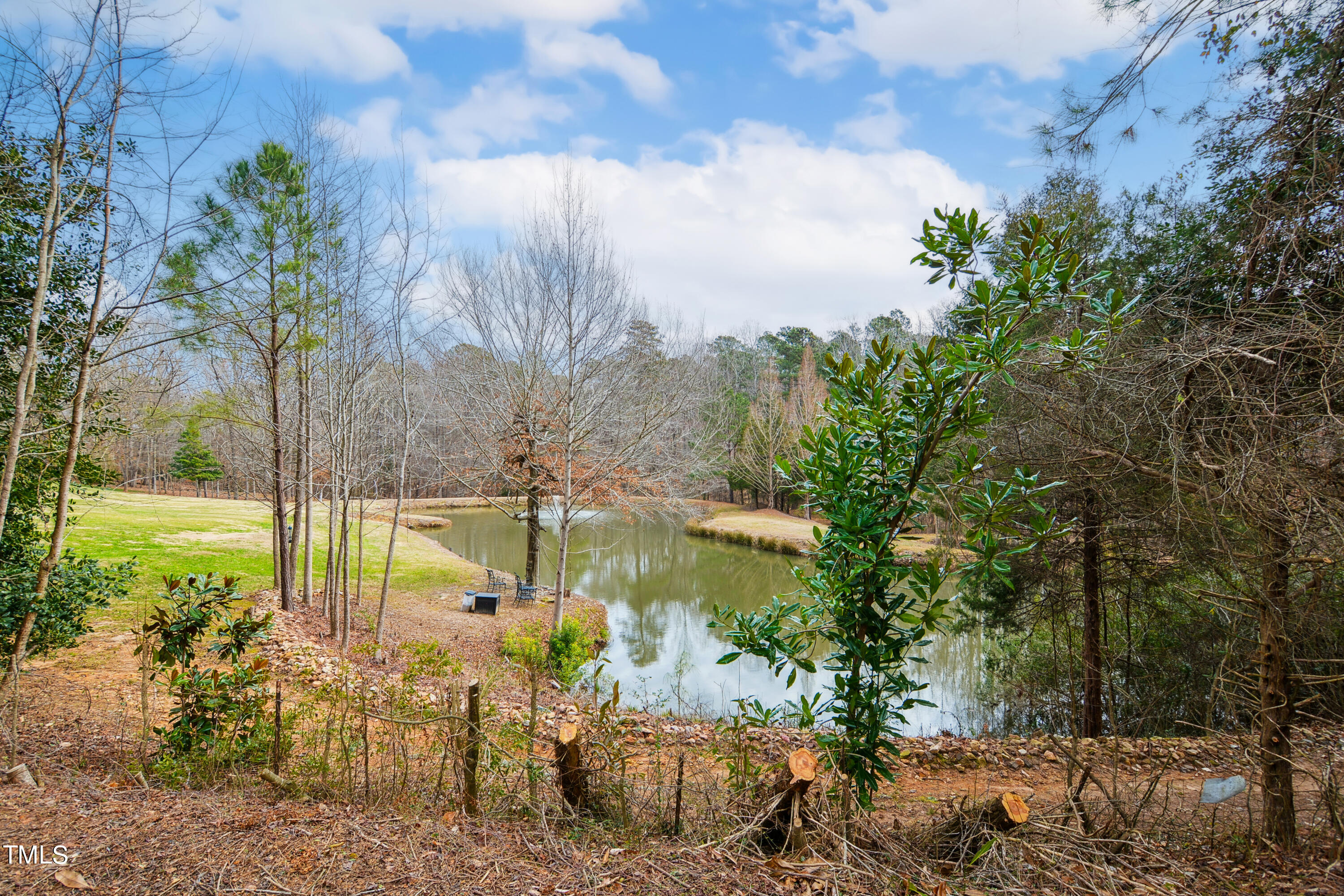 3101 Shinleaf Court Raleigh, NC 27613 - Photo 44 of 44 a view of a lake with a garden