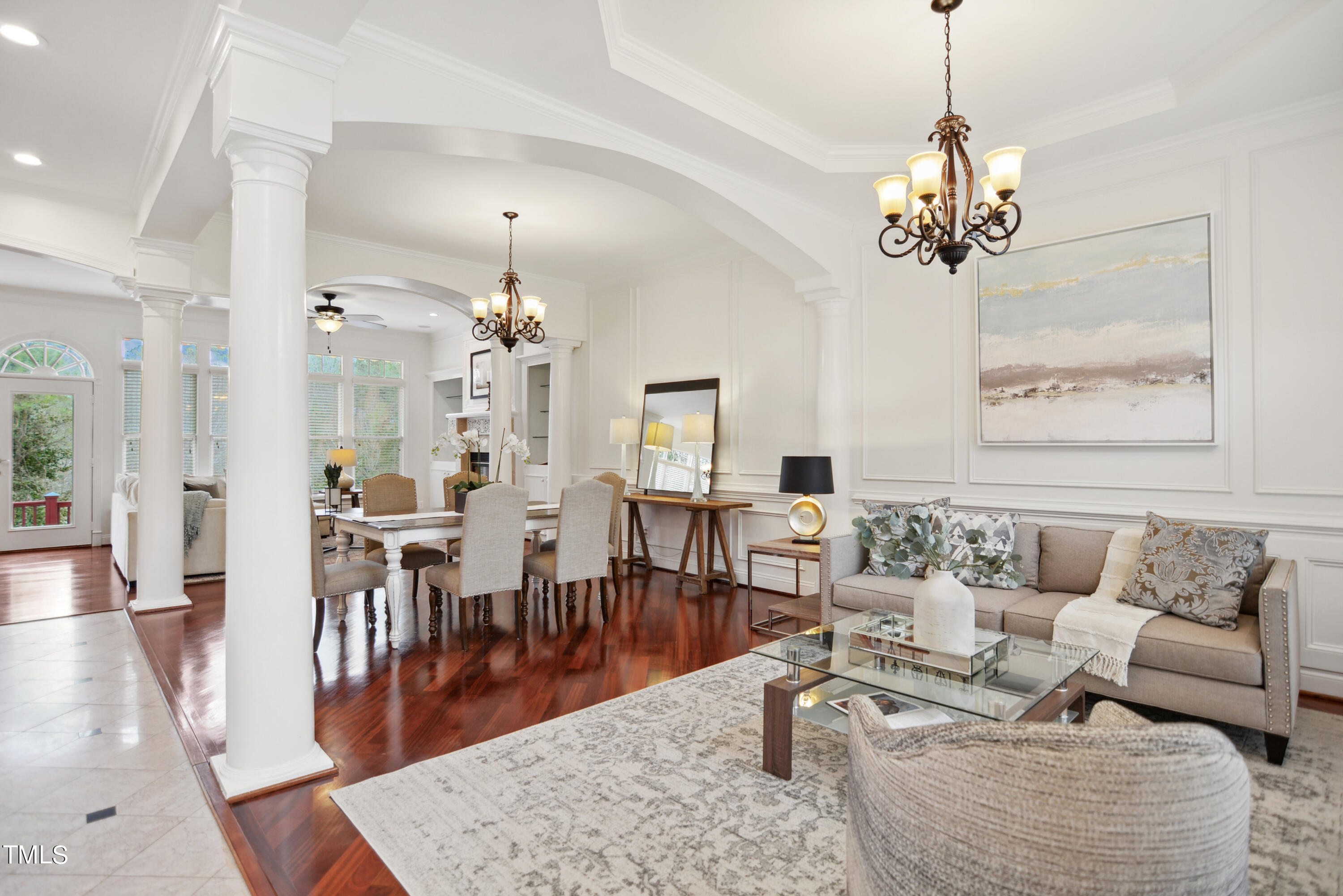 3101 Shinleaf Court Raleigh, NC 27613 - Photo 5 of 44 a living room with furniture chandelier and wooden floor