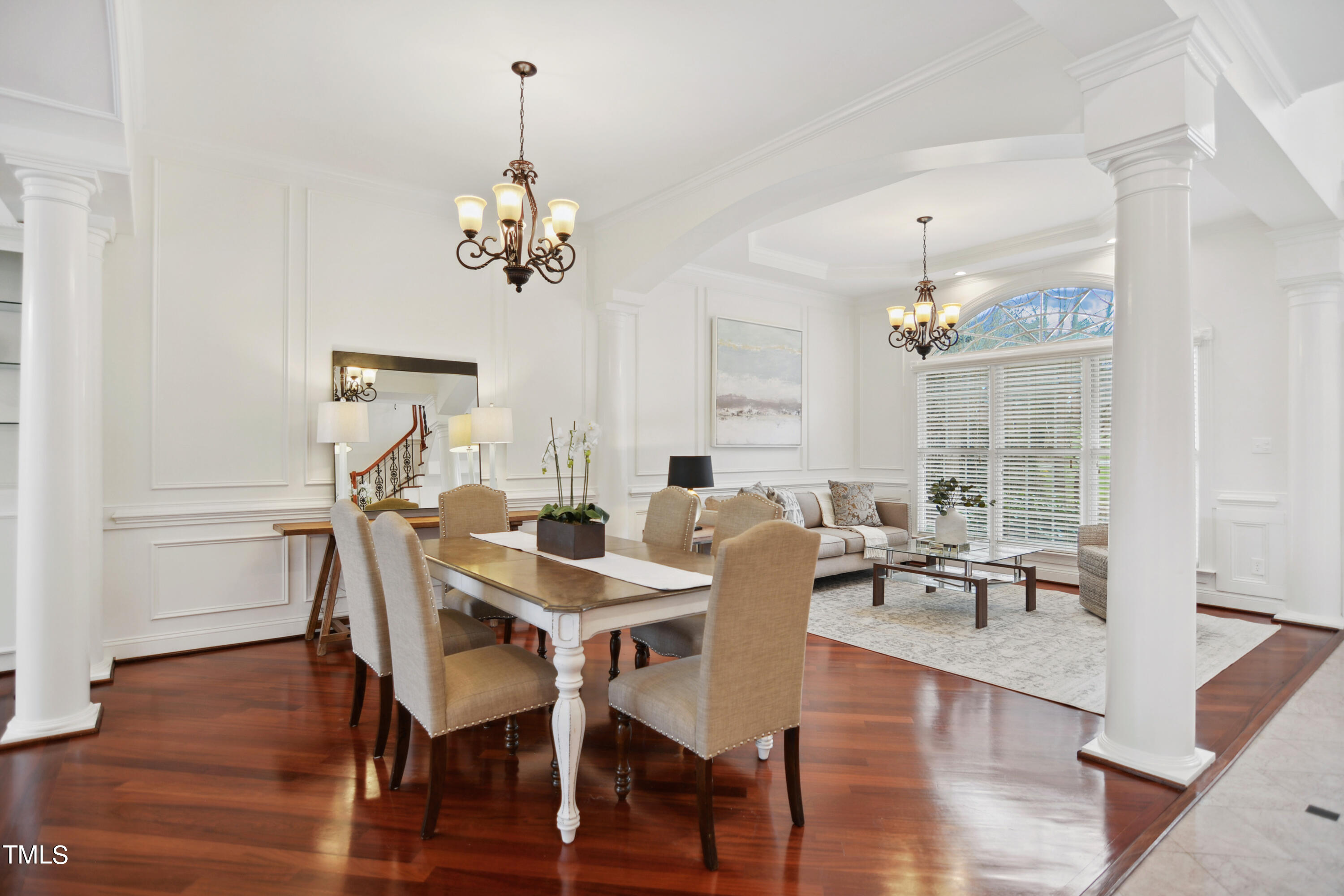 3101 Shinleaf Court Raleigh, NC 27613 - Photo 6 of 44 a view of a dining room with furniture wooden floor and chandelier