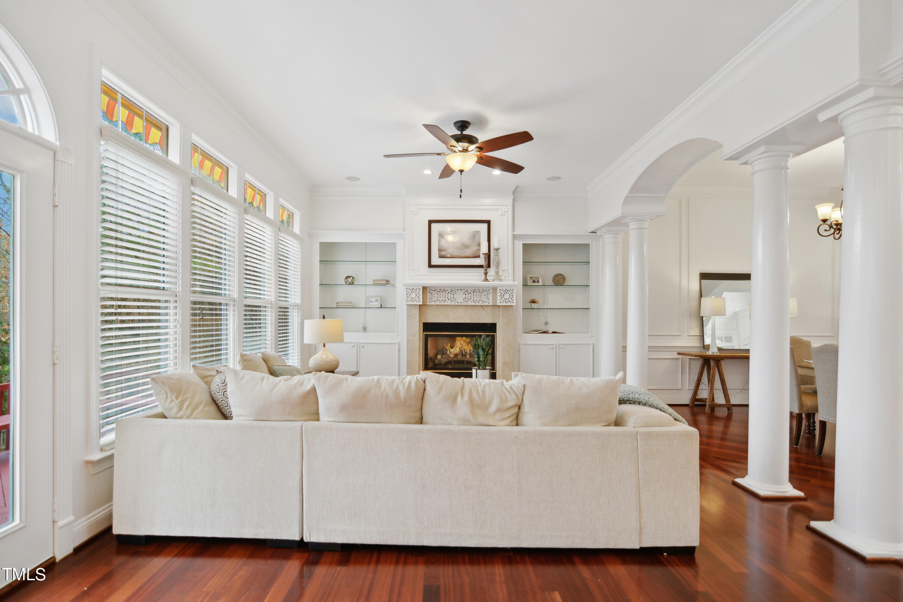 3101 Shinleaf Court Raleigh, NC 27613 - Photo 10 of 44 a living room with furniture a fireplace and wooden floor