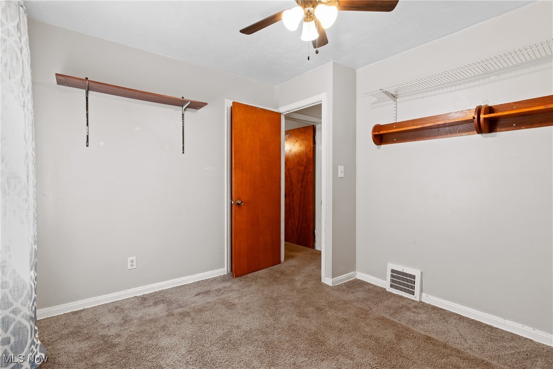 4503 Fulton Road Old Brooklyn, OH 44144 - Photo 14 of 24 Carpeted spare room featuring ceiling fan and baseboards
