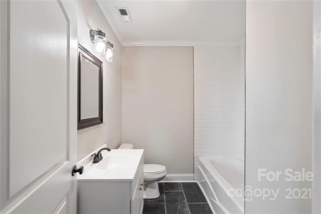 235 Porter Road Rock Hill, SC 29730 - Photo 11 of 29 a bathroom with a sink and mirror with toilet