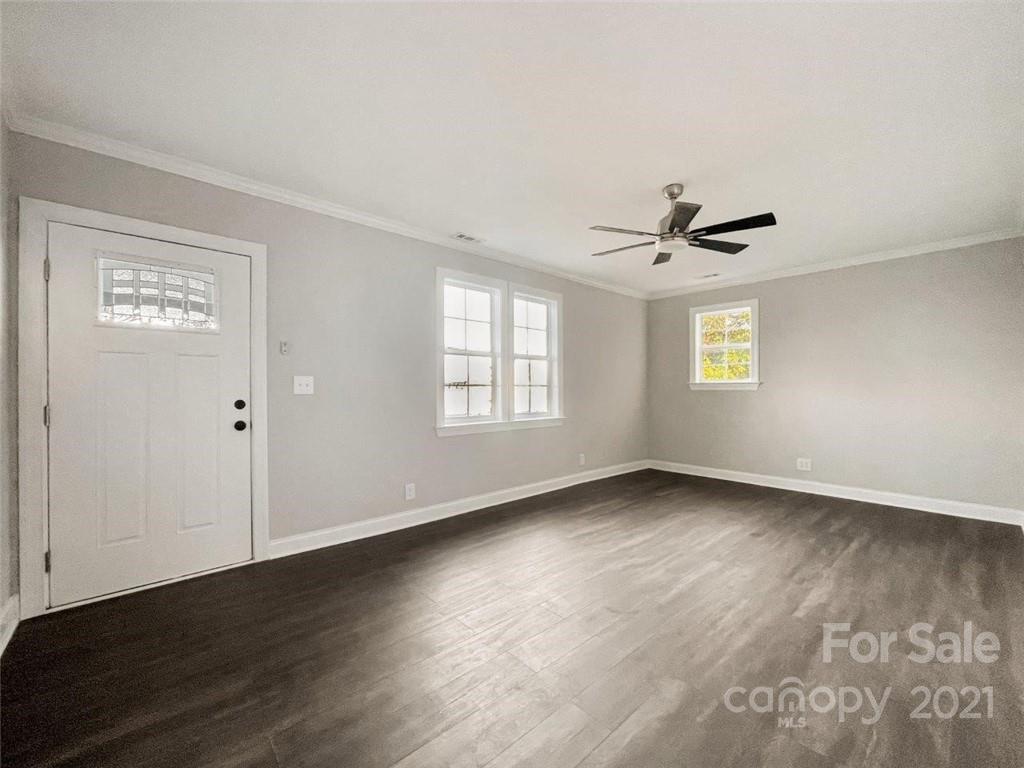 235 Porter Road Rock Hill, SC 29730 - Photo 16 of 29 a view of an empty room with wooden floor and a window