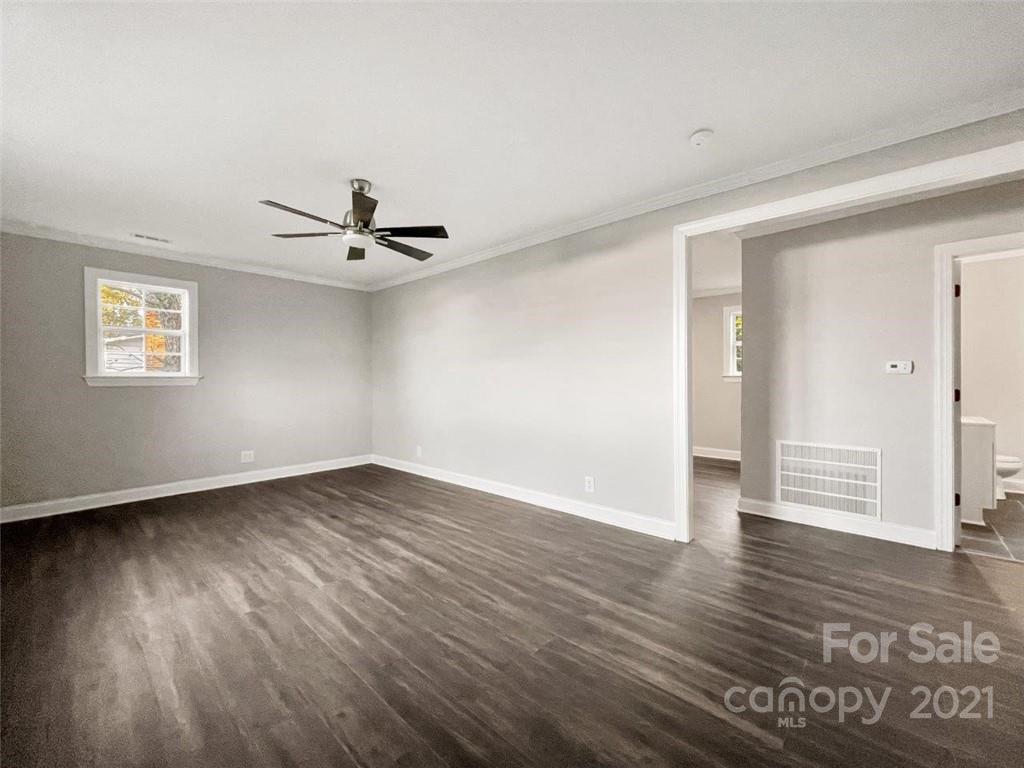 235 Porter Road Rock Hill, SC 29730 - Photo 17 of 29 an empty room with wooden floor and windows