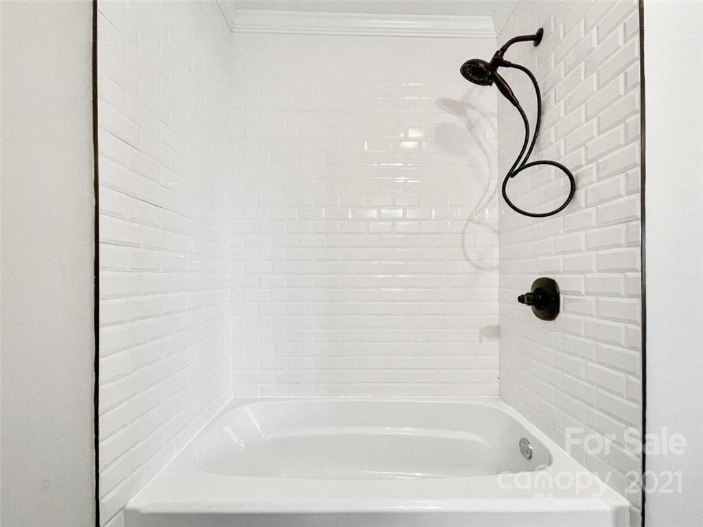 235 Porter Road Rock Hill, SC 29730 - Photo 20 of 29 a bathroom with a bath tub with a shower
