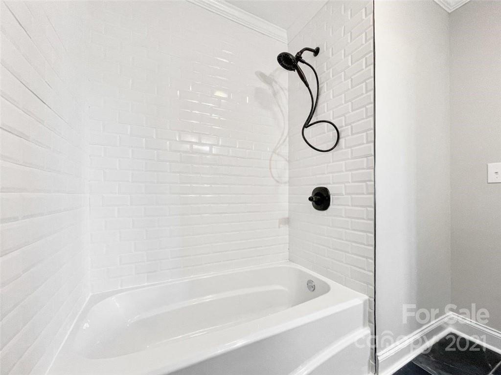 235 Porter Road Rock Hill, SC 29730 - Photo 21 of 29 a bathroom with a bath tub with a shower
