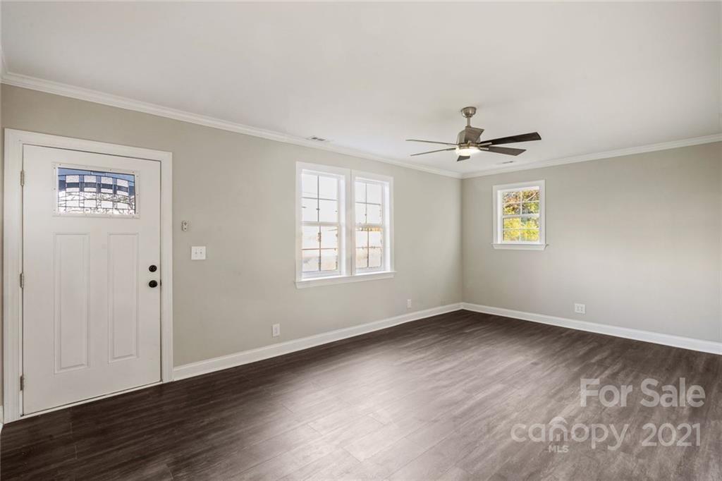 235 Porter Road Rock Hill, SC 29730 - Photo 26 of 29 a view of an empty room with wooden floor and a window