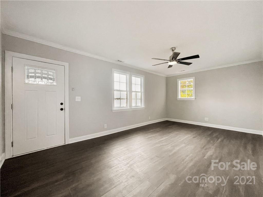 235 Porter Road Rock Hill, SC 29730 - Photo 27 of 29 a view of an empty room with wooden floor and a window