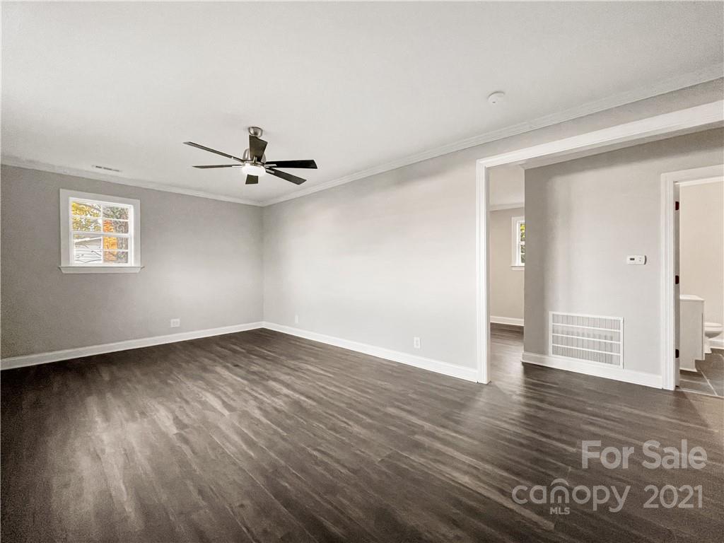 235 Porter Road Rock Hill, SC 29730 - Photo 28 of 29 an empty room with wooden floor and windows