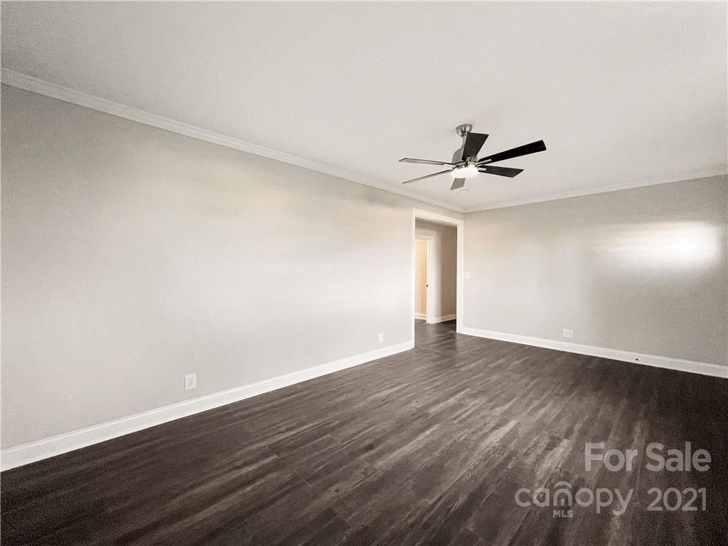 235 Porter Road Rock Hill, SC 29730 - Photo 29 of 29 a view of an empty room with wooden floor and a ceiling fan