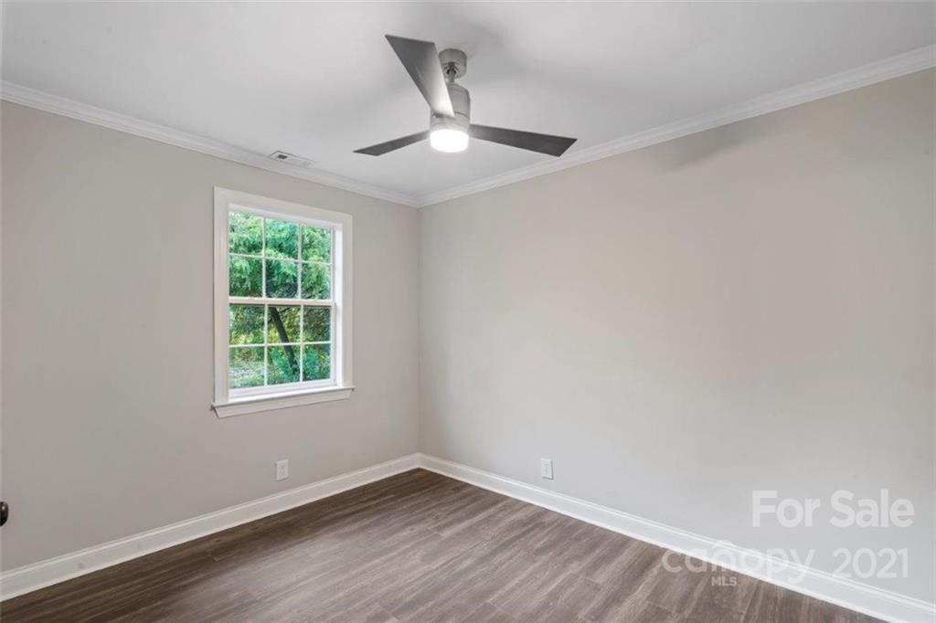 235 Porter Road Rock Hill, SC 29730 - Photo 10 of 29 an empty room with wooden floor and windows