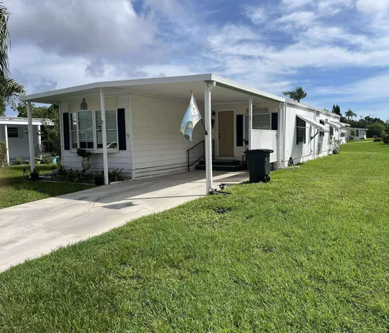 a view of a porch in front of house