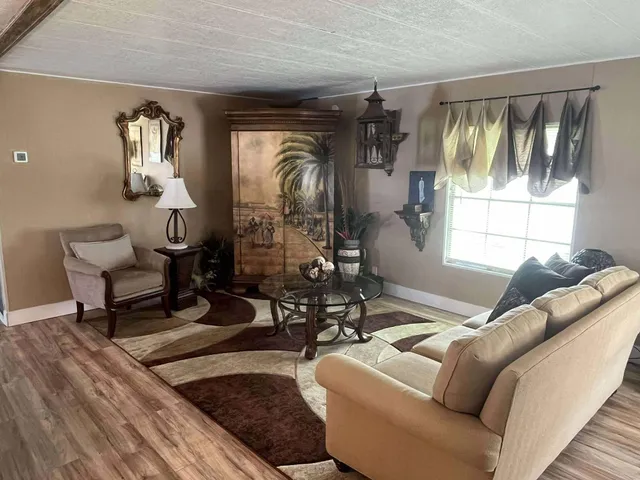 a living room with furniture and a window