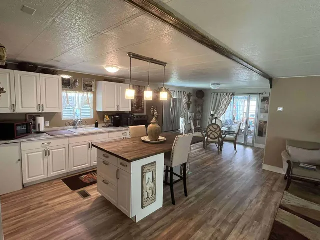 a kitchen with lots of counter top space and dining table