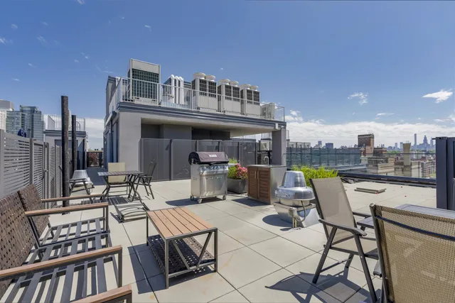 a view of a terrace with chairs and potted plants