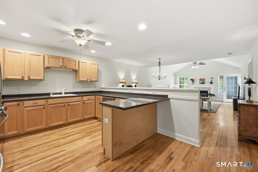 98 Haley Lane, Unit 98 Newtown, CT 06482 - Photo 11 of 33 a kitchen with stainless steel appliances granite countertop a sink and cabinets