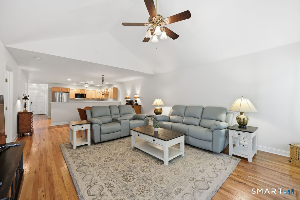 98 Haley Lane, Unit 98 Newtown, CT 06482 - Photo 19 of 33 a living room with furniture and a rug