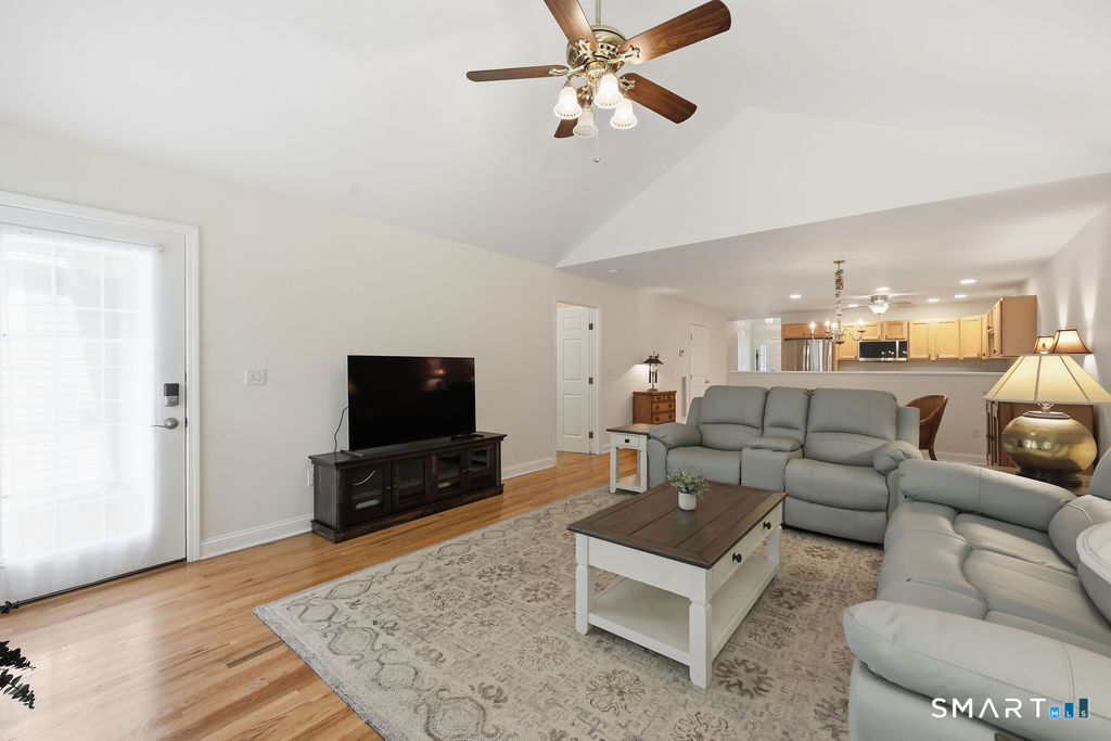 98 Haley Lane, Unit 98 Newtown, CT 06482 - Photo 22 of 33 a living room with furniture and a flat screen tv