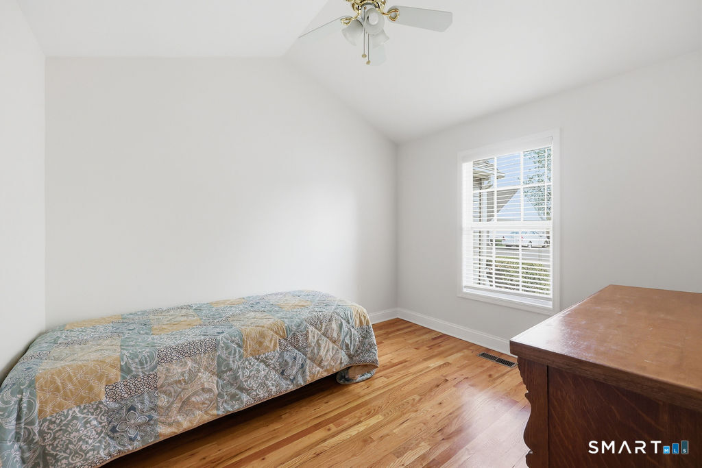 98 Haley Lane, Unit 98 Newtown, CT 06482 - Photo 29 of 33 a bedroom with a bed and a window