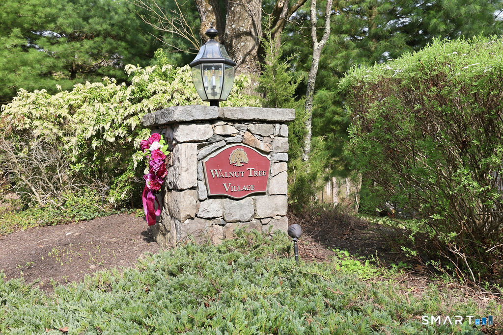 98 Haley Lane, Unit 98 Newtown, CT 06482 - Photo 30 of 33 a sign that is on the side of the road