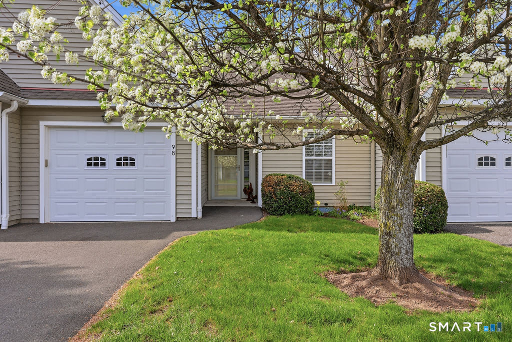 98 Haley Lane, Unit 98 Newtown, CT 06482 - Photo 6 of 33 a view of a house with a yard and large tree