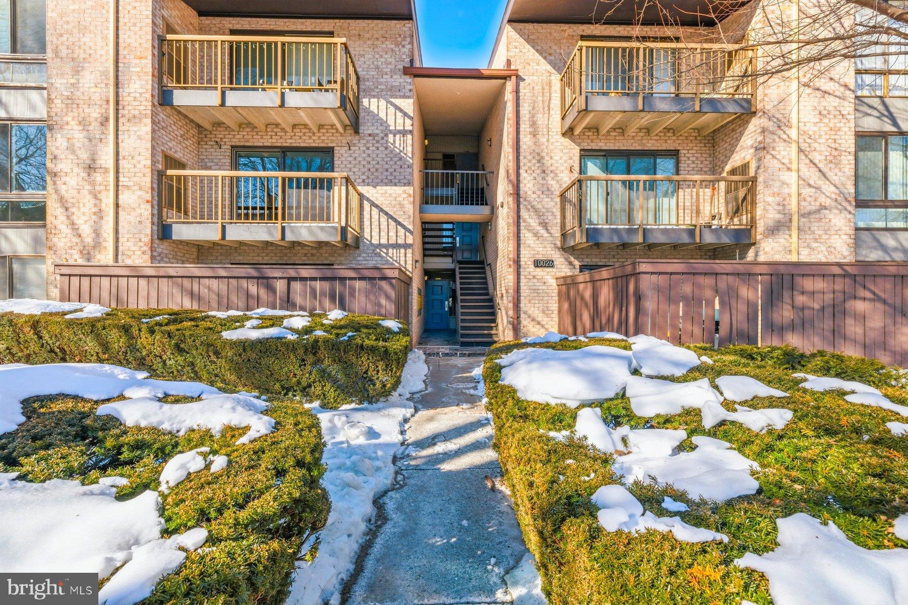 Charming brick apartment with inviting walkways.