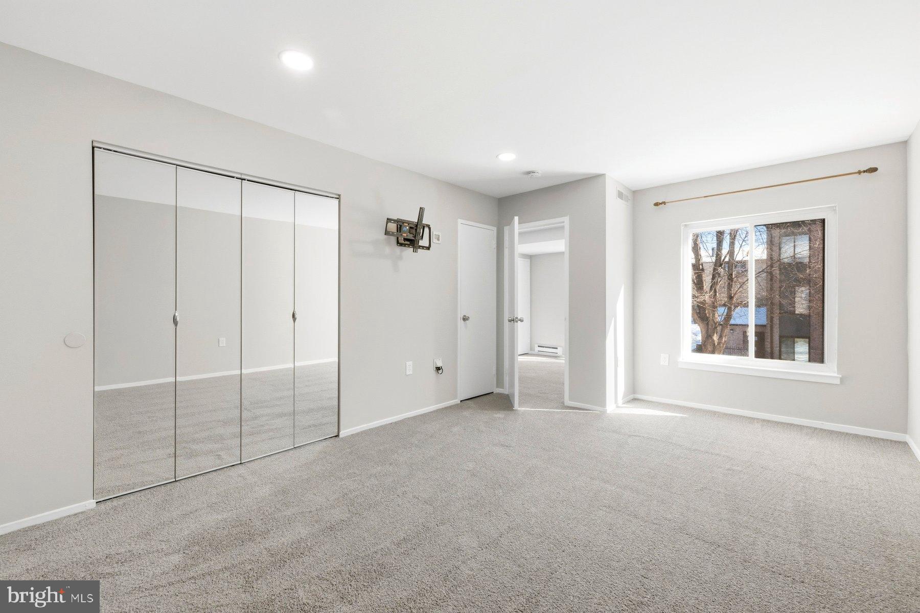 10026 Stedwick Road, Unit 201 Gaithersburg, MD 20886 - Photo 20 of 25 Bright and airy room with modern finishes.