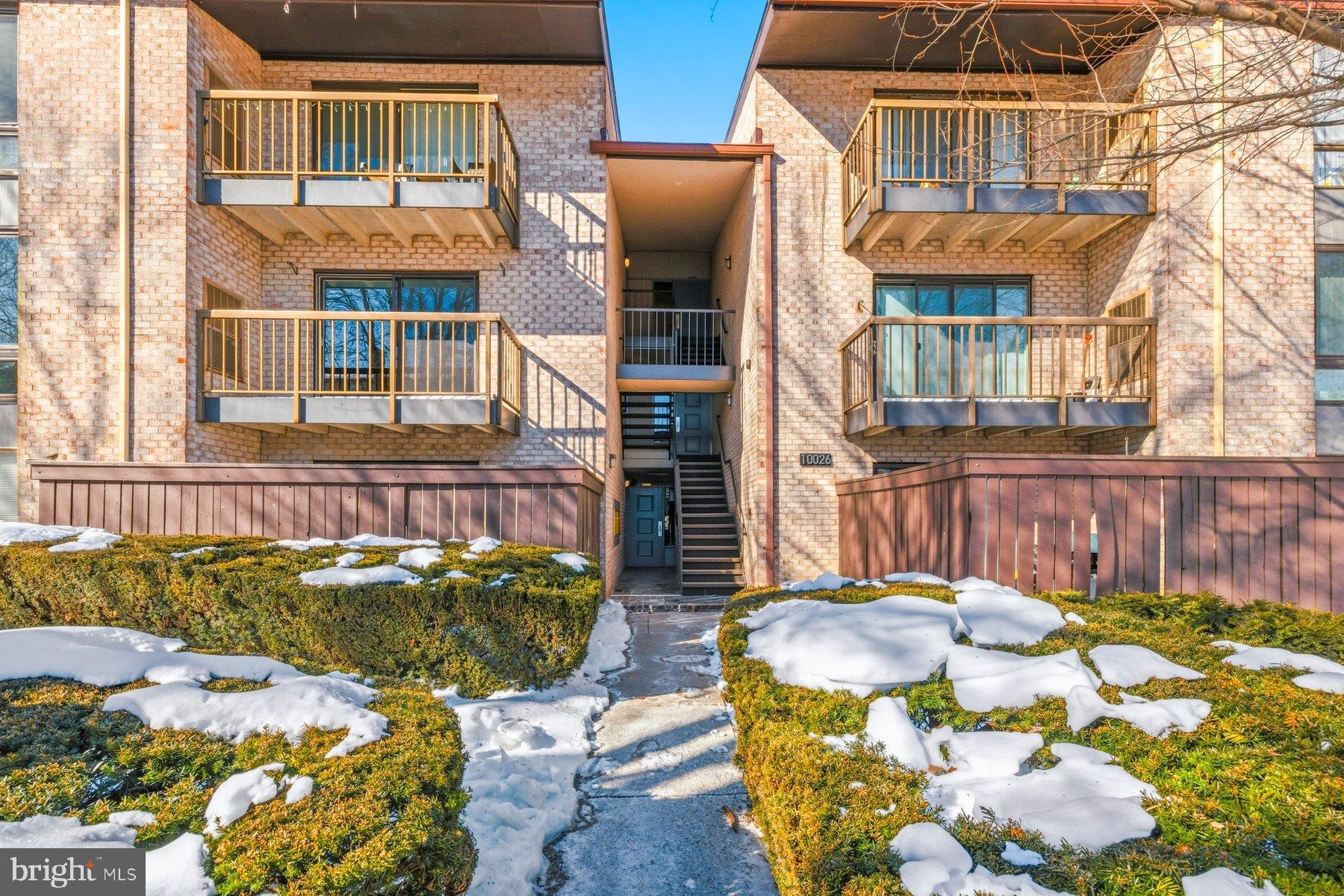 10026 Stedwick Road, Unit 201 Gaithersburg, MD 20886 - Photo 2 of 25 Charming brick apartment with inviting balconies.