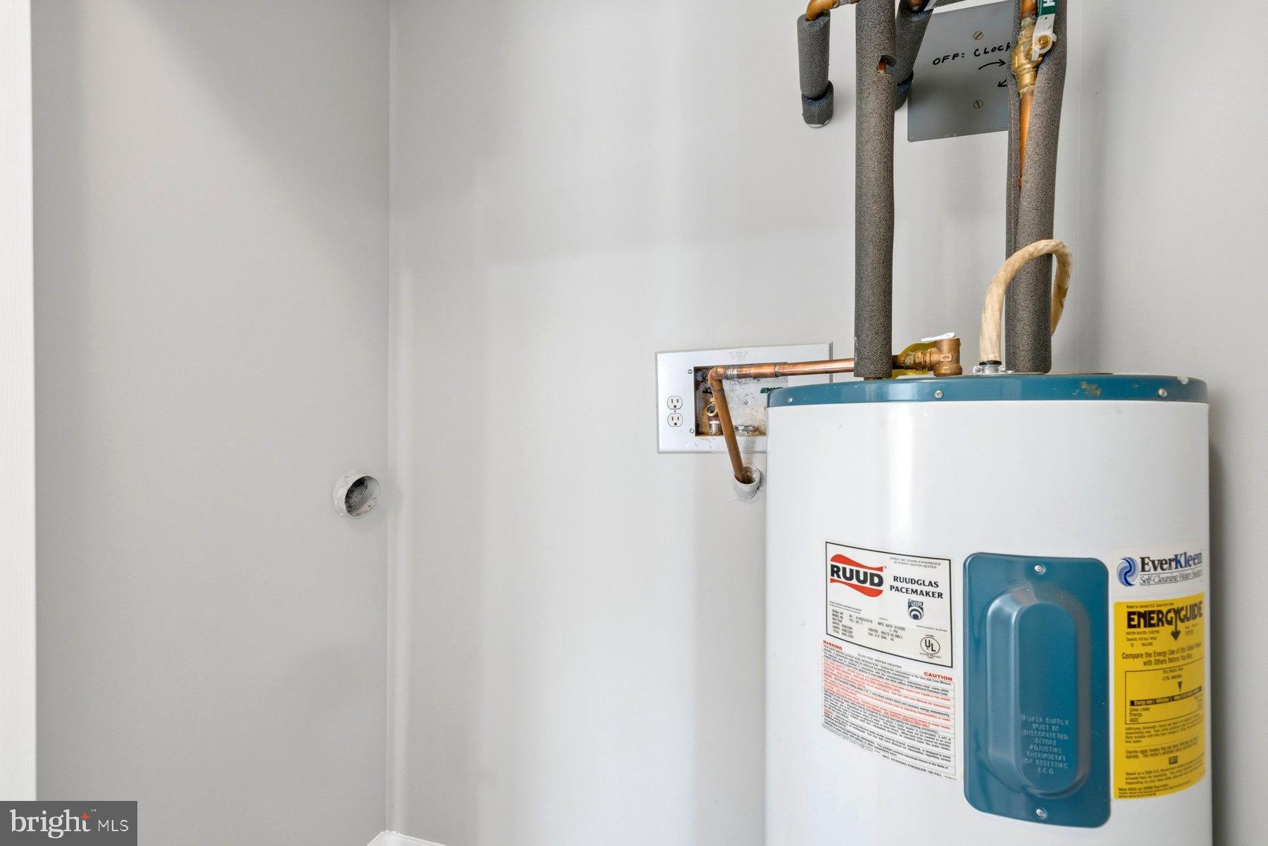 10026 Stedwick Road, Unit 201 Gaithersburg, MD 20886 - Photo 21 of 25 Modern water heater in a sleek utility space.
