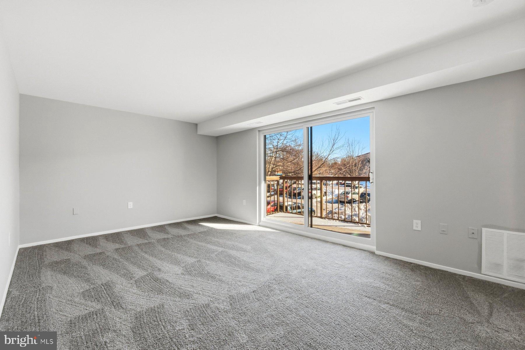 10026 Stedwick Road, Unit 201 Gaithersburg, MD 20886 - Photo 7 of 25 Bright and airy space with scenic views.