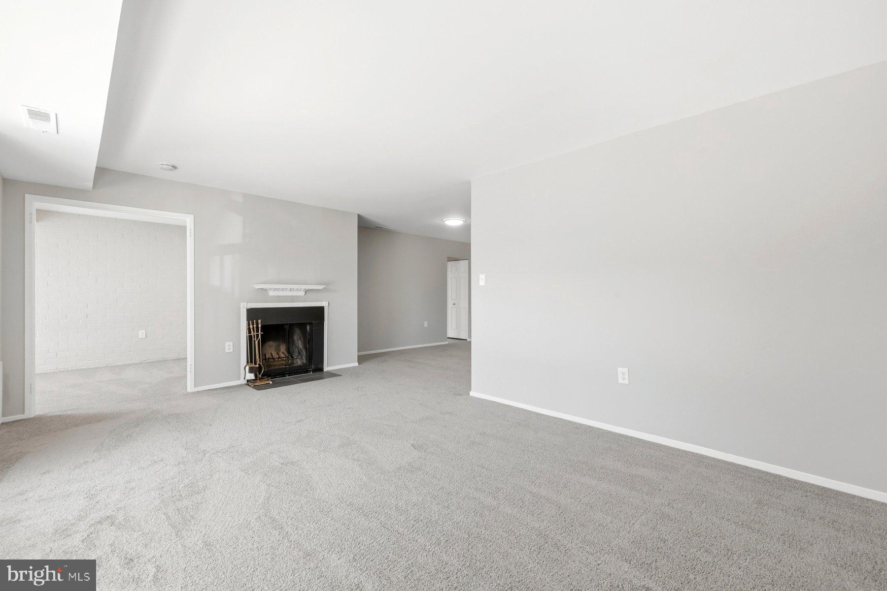 10026 Stedwick Road, Unit 201 Gaithersburg, MD 20886 - Photo 9 of 25 Spacious, light-filled living area awaits you.