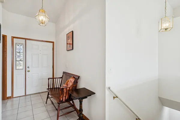 a view of a hallway with seating area