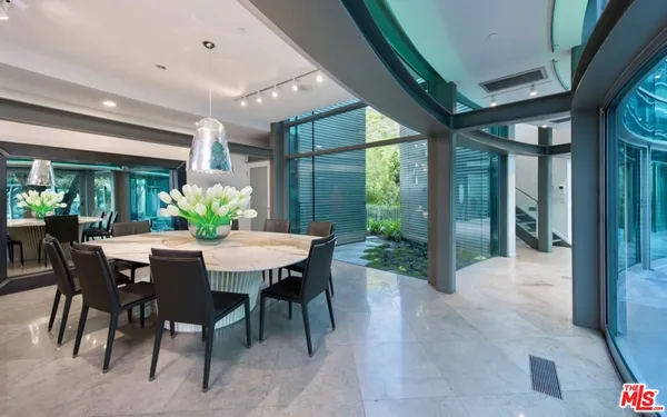 a kitchen with stainless steel appliances lots of counter space and a sink