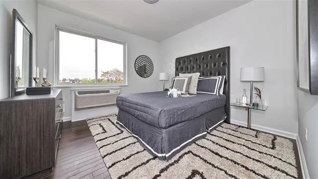 a living room with a couch and a large window