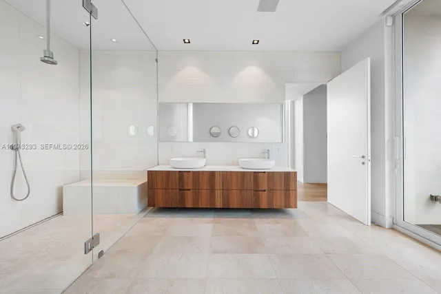 a bathroom with a tub sink and shower